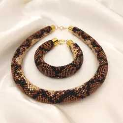 دستبند پوست مار منجوق بافی شده