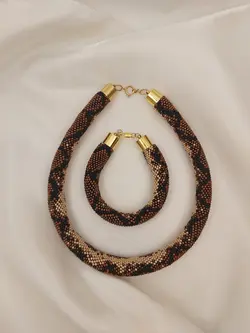 دستبند پوست مار منجوق بافی شده