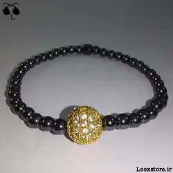 دستبند حدید دودی ریز و مهره نگین دار طلایی