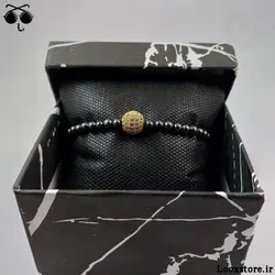 دستبند حدید دودی ریز و مهره نگین دار طلایی