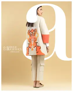 ست مانتو و شلوار کرم همراه با گلدوزی های نارنجی