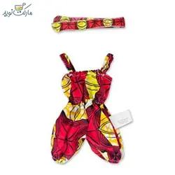 عروسک دختر مو فرفری سیاهپوست با لباس قرمز زرد