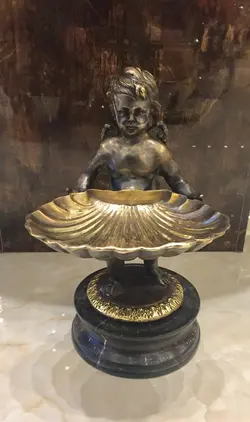 شیرینی خوری آدمک برنز