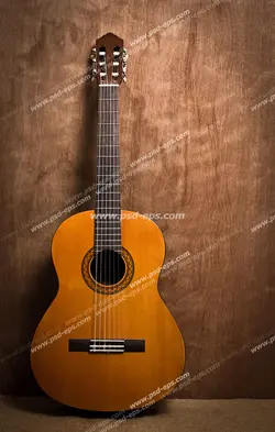 عکس با کیفیت تبلیغاتی گیتار کلاسیک با بدنه ی نارنجی بر روی میز چوبی