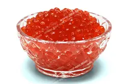 عکس با کیفیت تخم سالمون یا تخم ماهی آزاد دریای شمال درون ظرف بلوری