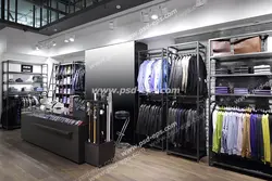 عکس با کیفیت فروشگاه یا بوتیک لباس و کیف و کفش و کمربند مردانه با دکوراسیون مدرن و نقره ای رنگ