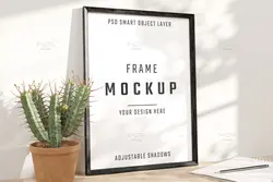 موکاپ قاب عکس مشکی کنار گلدان کاکتوس روی میز چوبی