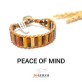 دستبند سنگی اصل استوانه ای چشم ببر و کلسیت بافت چرم و دکمه