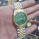 ساعت رولکس ست زنانه و مردانه صفحه سبز خاص تقویم دار رنگ ثابت استیل ضدآب ارسال رایگان با جعبه همراه با فیلم تست ضد اب