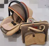 سرویس سیسمونی رنگ کرم کالسکه_کریر_کوله پشتی_صندلی غذا زویه_روروئک