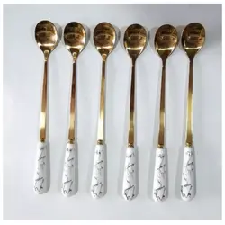 قاشق شربت خوری طلایی دسته سرامیک سفید طرح ماربل قیمت درج شده برای ۶عدد میباشد