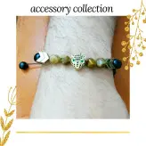 دستبند مردانه سنگ چشم ببر اونیکس مشکی حدید طلایی اکسسوری دست ساز