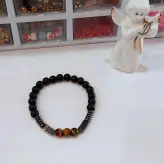 دستبند مردانه سنگ چشم ببر اونیکس مشکی حدید دودی رنگ ثابت اکسسوری دست ساز مردانه