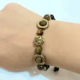 دستبند مردانه سنگ چشم ببر و حدید طلایی و سر ببر سوارسکی و اونیکس مشکی زیورآلات دستساز رنگ ثابت