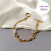 دستبند زنانه ۳ لاین زنجیر توپی طلایی استیل دارای قفل t کد ۱۳۹۷
