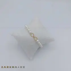 دستبند طلا بینهایت مرواید دست ساز - گالری طلای زرخانه