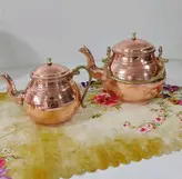 کتری مسی و قوری مس دسته برنجی .کتری 2 لیتری داخل قلع ارتفاع کتری 17.ارتفاع قوری 13 سانت.ارسال رایگان در مس زنجان نمونه