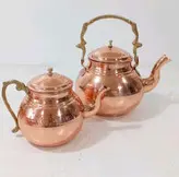 کتری مسی و قوری مس دسته برنجی .کتری 2 لیتری داخل قلع ارتفاع کتری 17.ارتفاع قوری 13 سانت.ارسال رایگان در مس زنجان نمونه