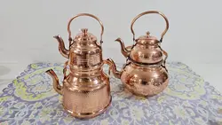 کتری مسی و قوری مس دسته برنجی .کتری 2 لیتری داخل قلع ارتفاع کتری 17.ارتفاع قوری 13 سانت.ارسال رایگان در مس زنجان نمونه