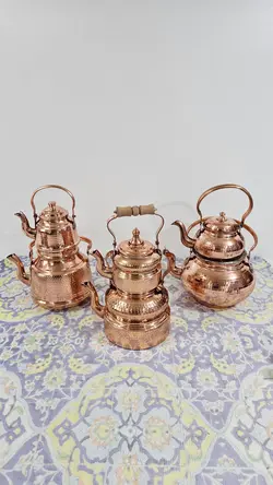 کتری مسی و قوری مس دسته برنجی .کتری 2 لیتری داخل قلع ارتفاع کتری 17.ارتفاع قوری 13 سانت.ارسال رایگان در مس زنجان نمونه