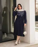 پیراهن مانتویی گلدوزی شده آستین دکمه دارد پشت لباس دکمه