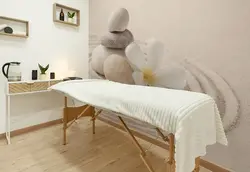 کاغذ دیواری سالن ماساژ طرح سنگ ذن روی ماسه ها