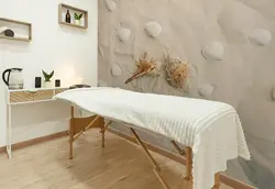 کاغذ دیواری  سالن ماساژ طرح صدف دریایی روی ماسه