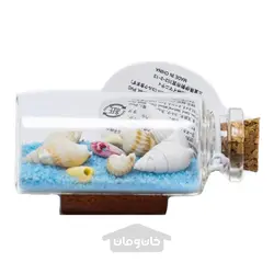 بطری افقی حاوی شن