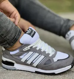 حراج ویژه کفش اسپرت مردانه پسرانه مدل ادیداس راحت و  بادوام رنگ طوسی سفید