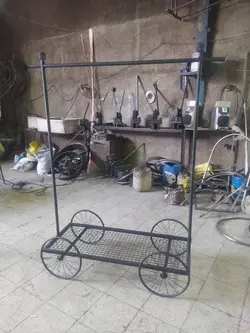 رگال آویز لباس طرح کالسکه چهار چرخ فلزی - فروشگاه آنلاین قفسه بندی امیر