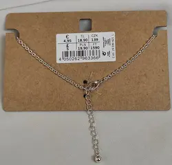 پابند استیل آویز دار نقره ای - فروشگاه زرمیس