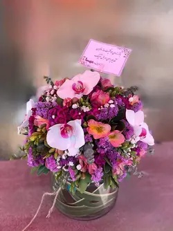 گل بنفش داخل جار گل فلوبار