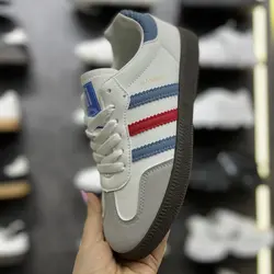 کفش آدیداس سامبا سفید | سه خط آبی‌قرمز و زیره تیره | وارداتی K.Shoes چین