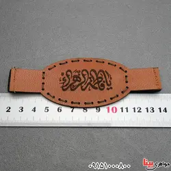 کبیر امام جواد روی پوست آهو با لوله حرز نقره و بازوبند چرمی _کد:27955
