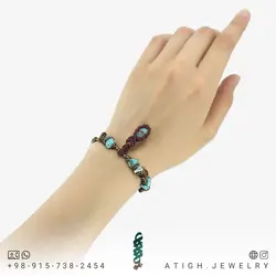 دستبند فیروزه نیشابوری صددرصد طبیعی دور بافت مکرومه همراه فیروزه مصری و چشم ببر نامنظم معدنی بسیار خاص بافت کشویی