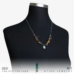 گردنبند فیروزه نیشابوری شجری دور قاب نقره 925 عیار و چشم ببر تراش نامنظم معدنی زنجیر استیل کیفیت سنگ عالی
