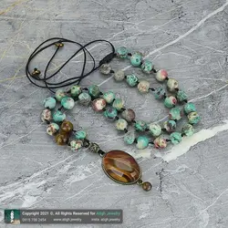 گردنبند فیروزه آفریقایی با نقش و نگار زیبا و چشم ببر معدنی فریم زردقلم چشم نظر بافت کشویی