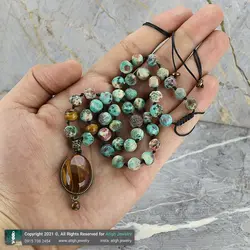 گردنبند فیروزه آفریقایی با نقش و نگار زیبا و چشم ببر معدنی فریم زردقلم چشم نظر بافت کشویی