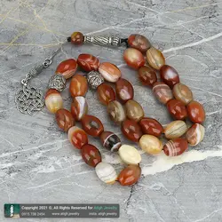 تسبیح کلکسیونی عقیق کارنلین سلیمانی معدنی با نقش و نگار زیبا دانه درشت تراش هلی 33 دانه دستساز کرکوش تُرک تک رشته ای بسیار خاص