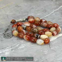 تسبیح کلکسیونی عقیق کارنلین سلیمانی معدنی با نقش و نگار زیبا دانه درشت تراش هلی 33 دانه دستساز کرکوش تُرک تک رشته ای بسیار خاص