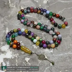 تسبیح و گردنبند لوکس احجار الشفا 43 نوع سنگ، هفت سنگ چاکرا، حدید محافظ هاله انرژی 101 دانه دستساز با شیخک عقیق زرد حکاکی شرف الشمس و تک مهره یشم معدنی