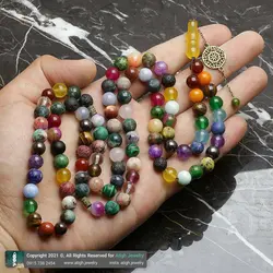 تسبیح و گردنبند لوکس احجار الشفا 43 نوع سنگ، هفت سنگ چاکرا، حدید محافظ هاله انرژی 101 دانه دستساز با شیخک عقیق زرد حکاکی شرف الشمس و تک مهره یشم معدنی