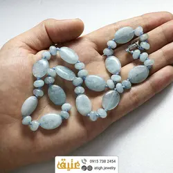 سینه ریز آکوامارین معدنی تراش بیضی و واشری بافت‌