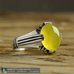 انگشتر عقیق زرد شرف الشمس خوشرنگ معدنی تراش دامله بیضی رکاب ۴ چنگ سیاه قلم شیاردار نقره ۹۲۵ عیار