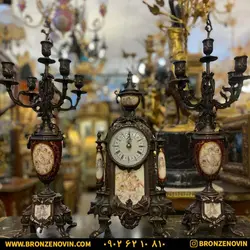 قیمت ساعت و شمعدان برنز برنجی لانچینی آنتیک با چینی زرشکی