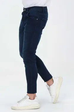 شلوار جین برش اسلیم فیت ساده دور کمر لایکرا سرمه ای تیره قالب تنگ مردانه برند BEHALLE کد 1667279724