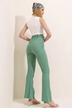 شلوار بافتنی کمربند‎دار پاچه اسپانیایی دوخت جلو چاک دار زنانه سبز نعنایی برند Trend Alaçatı Stili کد 1646726984
