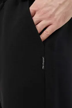 شلوار راحتی برش راحت ساده پاچه مشکی مردانه برند METALIC کد 1668695586