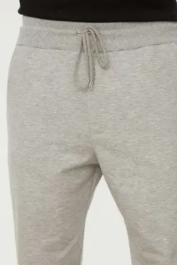 شلوار راحتی متناسب مردانه ساده پاچه لاستیک طوسی برند TRENDYOL MAN کد 1647099656