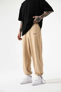 شلوار راحتی گشاد ساده بژ بگی مردانه برند Machinist کد 1697773330